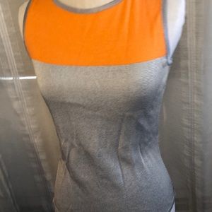 Silver/ orange kukhavera London sleeveless top. Size 4 US NWT